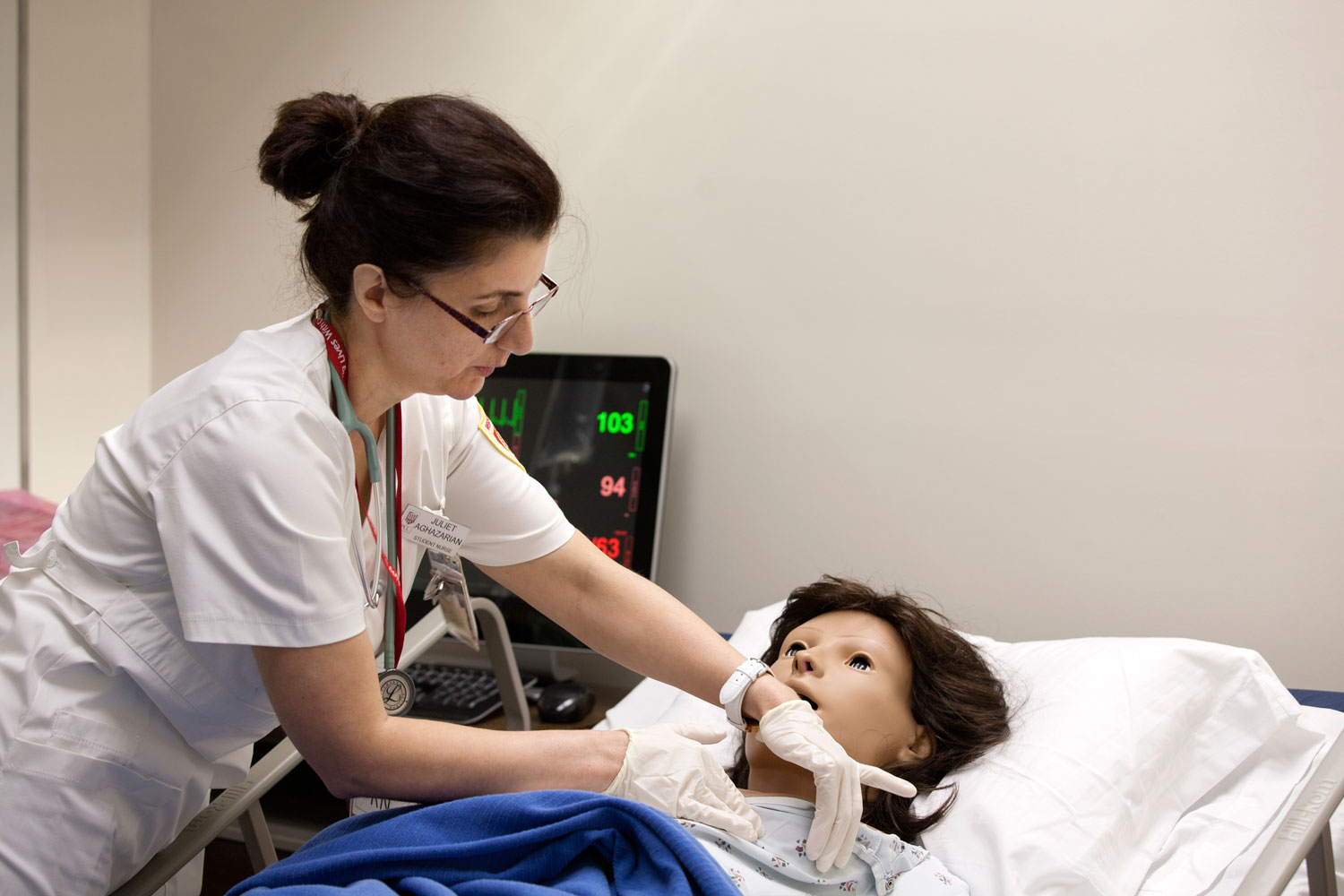 Students get practical training during a nursing class.