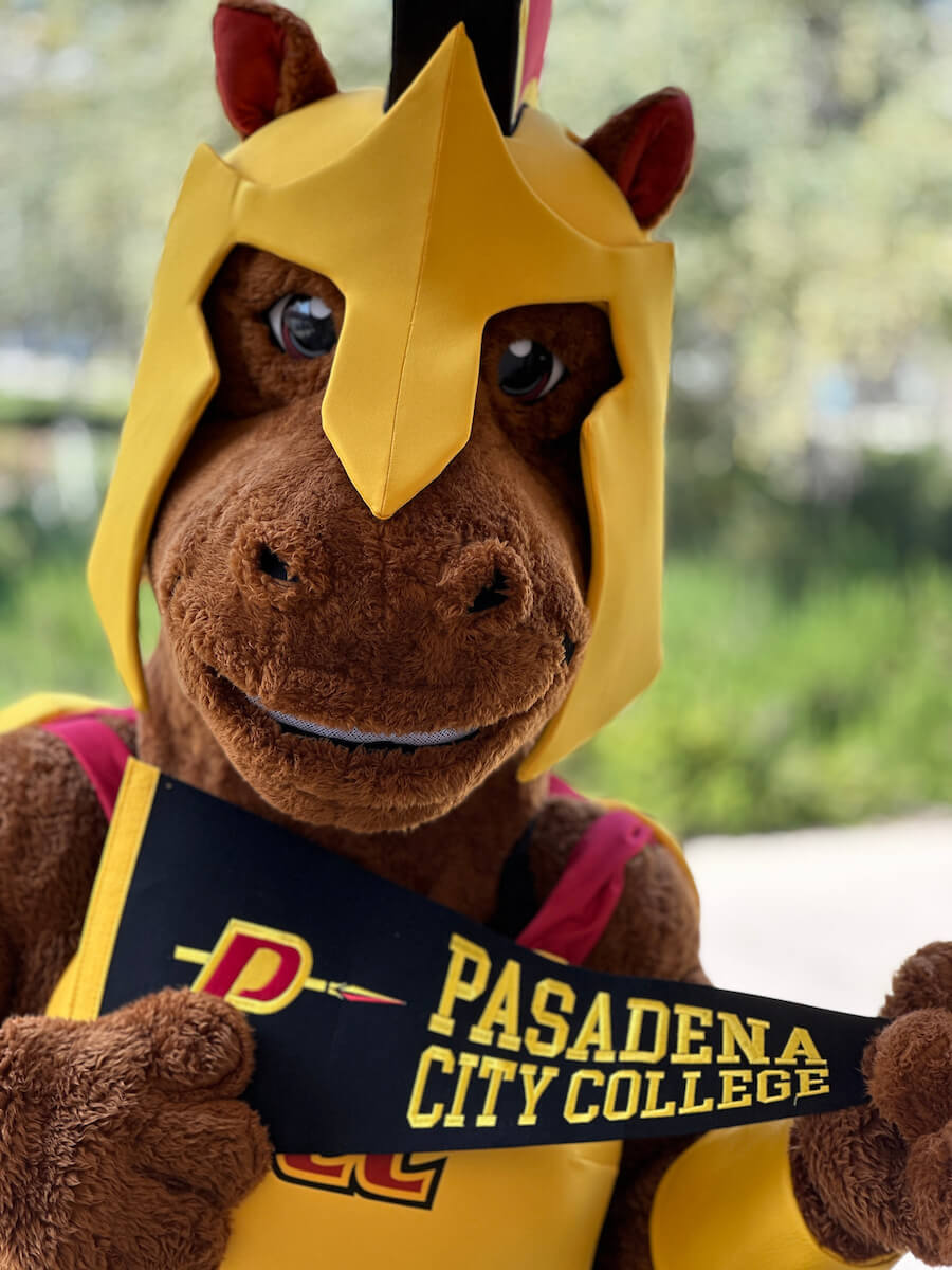 Larry lancer holding a PCC banner