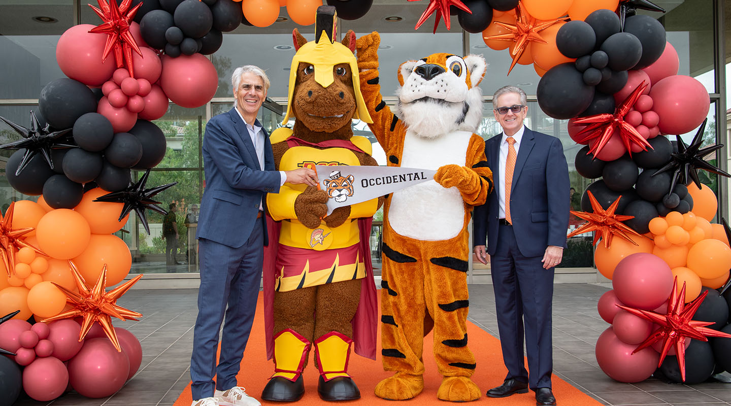Both college preseidents pose with college mascots